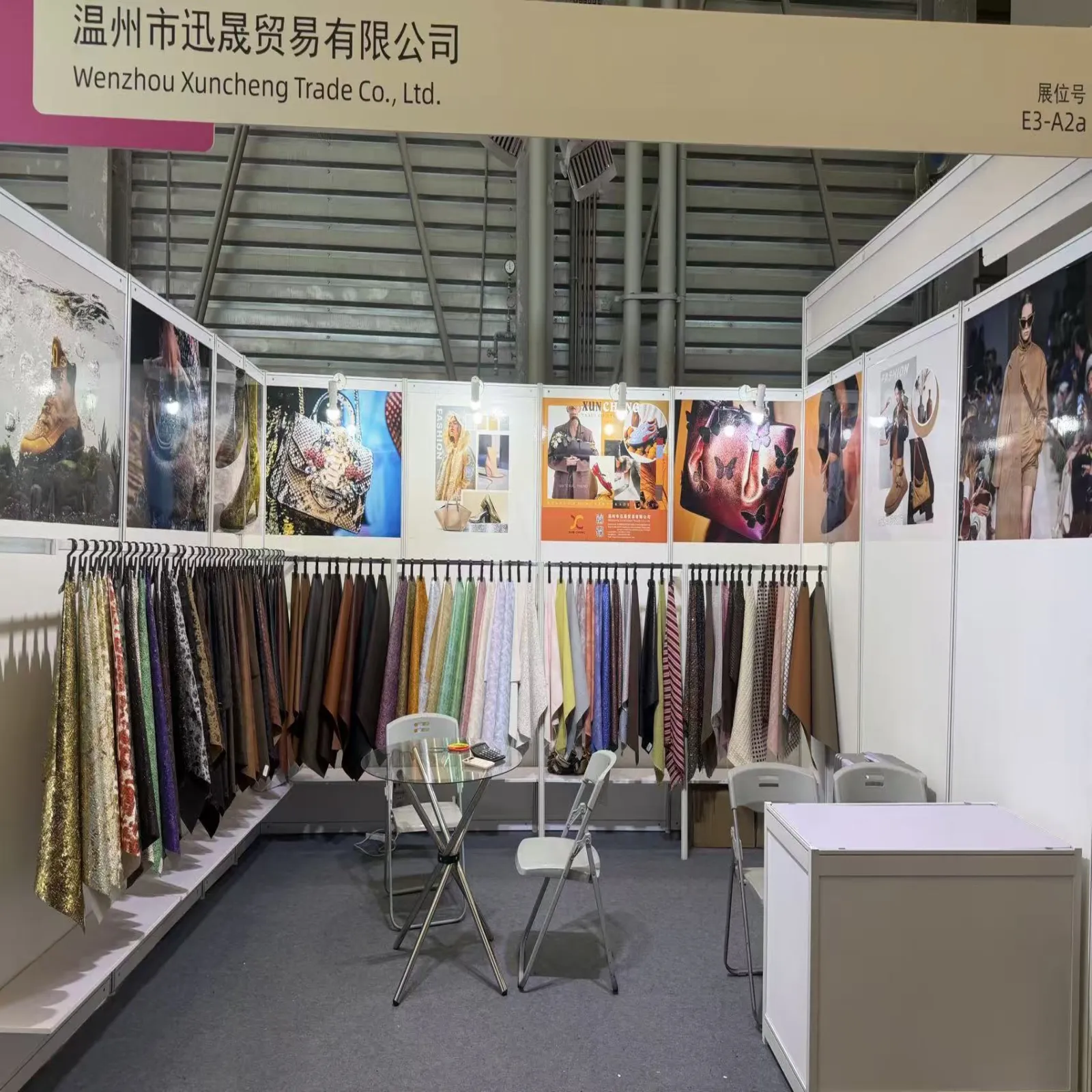 Synthetic leather samples and product displays at the Xuncheng booth