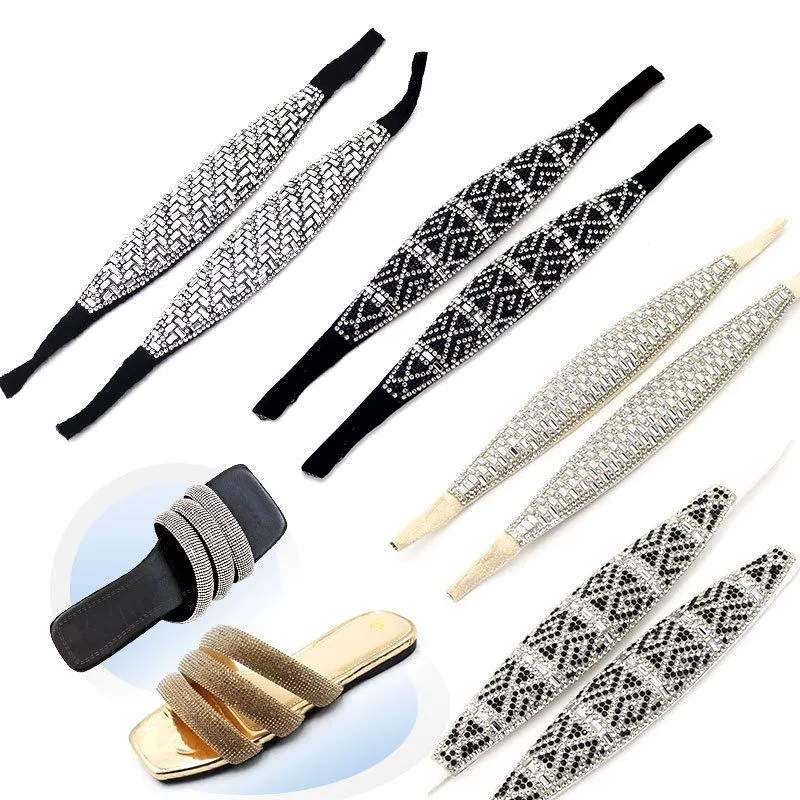 Several densely set rhinestone shoe upper straps alongside finished gold and black rhinestone slides
