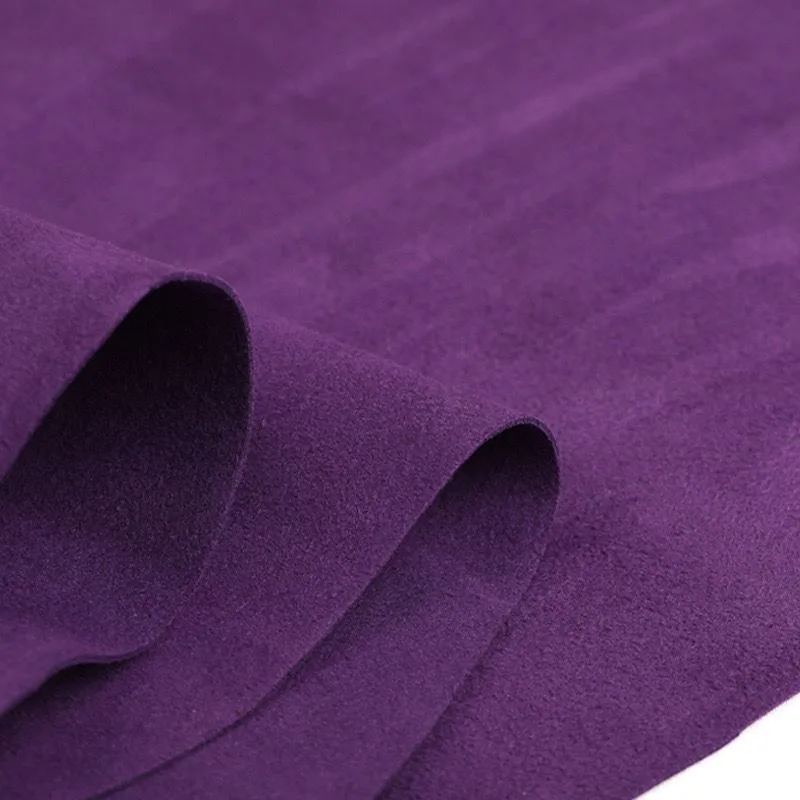 Close-up of folded purple microfiber suede synthetic leather showing its fine napped surface